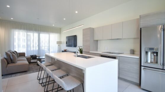 a kitchen with a refrigerator freezer sitting next to a counter